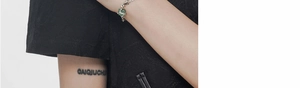Macro detail of S925 sterling silver bamboo style bracelet with green aventurine stone