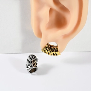 Skull alien magnetic ear weights in gold and silver with black triangular relief patterns