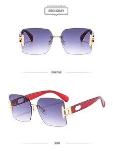 Detail view of square rimless sunglasses with purple gradient lenses and red temples