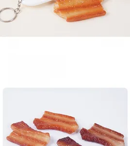 Detailed macro view of realistic PVC cured bacon slices model with metal keychain attachment