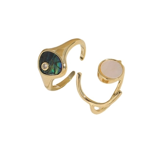 Golden rings featuring colorful abalone shell and circular mother of pearl with zircon accents