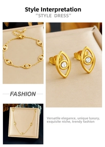 Macro detail of gold plated stainless steel devil eye necklace and earrings set