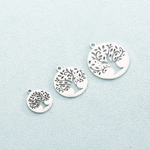 Three silver stainless steel hollow Tree of Life round pendants in multiple sizes
