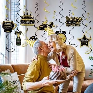 Elegant black and gold retirement party hanging swirls with happy retirement decorations