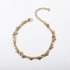 Gold double-layered stainless steel bracelet with heart pendants and spacer beads