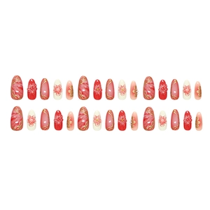 Press-on nails with red floral art, gold lines, and marble texture in almond shape