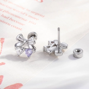 Silver bow stud earrings with clear and purple heart zircons and screw backings