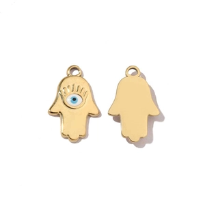 Detailed front and back view of gold hand pendant with blue eye and polished finish