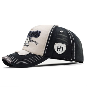 Close-up of vintage distressed baseball cap with retro embroidery and patches