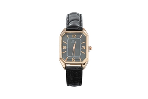 Detail of rose gold octagonal quartz watch with black leather strap and numeral dial