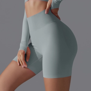 Detail view of high-waisted seamless scrunch butt yoga shorts in light blue gray knit