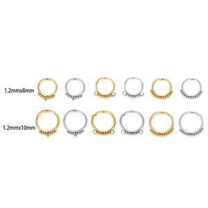 Detail view of 20G medical steel nose rings in gold and silver showing 8mm and 10mm sizes