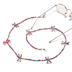 Handmade multi-color beaded eyewear chain with striped bow accents and gold-tone hardware