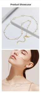Detail of S925 silver gold-plated necklace with elegant white freshwater pearls