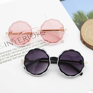 Kids round petal sunglasses with gold metal temples in pink and white frames