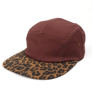 Detailed 5-panel camper hat featuring burgundy twill fabric and leopard print brim
