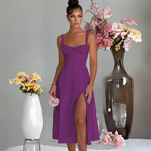 Detail view of purple slim fit camisole midi dress with high side slit on female model