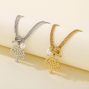Detail of silver and gold Tree of Life double layer necklaces with OT toggle and pearl