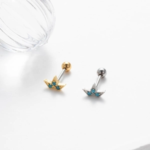Star-shaped stainless steel cartilage studs with turquoise stones in gold and silver