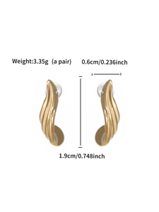 Detailed view of gold-plated curved earrings with rhinestones showing weight and dimensions