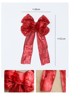 Detail of red glitter Christmas bow featuring texture close-up and 20x33cm dimensions