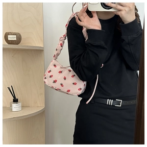 Pink strawberry print baguette shoulder bag with stylish ruched strap detail