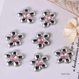 Detail showing 25x27mm silver metal flower charms with pink center gemstones