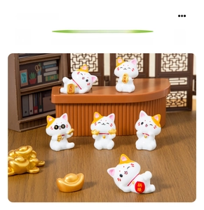 Macro detail of six cute resin lucky cat figurines in a miniature scenery display