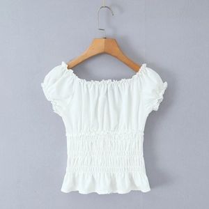 Detail of white square neck top with elastic smocking and ruffle trim texture