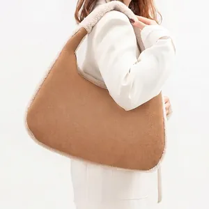 Retro shoulder bag in brown faux suede with white plush trim for women in autumn