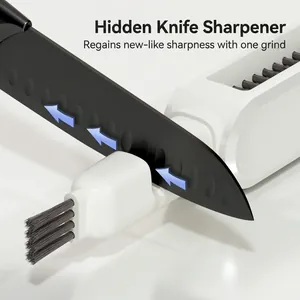 White 2-in-1 kitchen knife cleaner and sharpener with a black coated blade in use