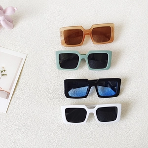 Stylish square frame kids sunglasses in amber mint black and white retro aesthetic