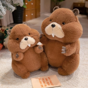 Cute brown marmot plush toy set with fluffy fur and white front teeth on soft carpet