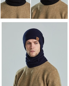Close-up of dark blue chunky knit beanie and neck warmer with thermal fleece lining