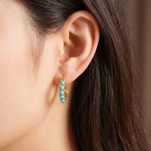 18k gold plated hoop earrings featuring turquoise resin beads in a bohemian style