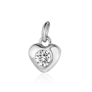 Macro detail of a silver heart-shaped pendant with a sparkling clear zircon stone center