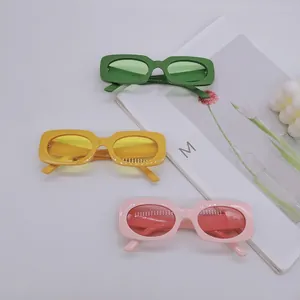 Retro rectangle sunglasses in candy colors like green, yellow and pink for a spring look