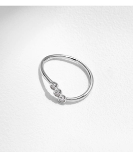 Close-up of S925 sterling silver ring featuring three parallel round white zircons