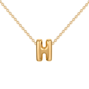 Macro detail of high-polish 3D bubble letter H pendant on a dainty gold plated chain
