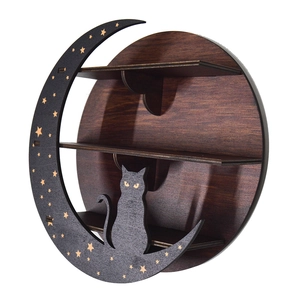 Detail of bohemian round wooden shelf with black cat and moon design on white background