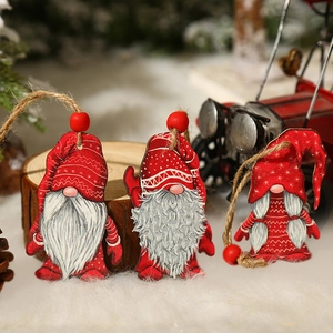 Set of three wooden Christmas gnome ornaments with red hats and rustic hanging strings