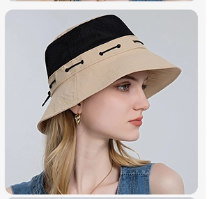 Detail of breathable black mesh and beige fabric on a summer sun bucket hat for outdoor use