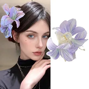 Detailed view of a purple lily flower hair claw clip with a stylish gradient fabric petal