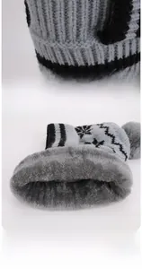 Detail of warm winter knit hat with soft fleece lining and gray snowflake pattern