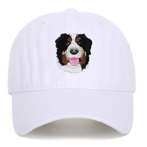 Detailed embroidery of a Bernese Mountain Dog on a white twill cotton baseball cap