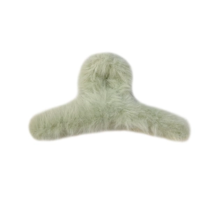Plush faux fur claw clip for women in sage green for autumn and winter hairstyles