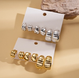 Six-piece set of geometric C-shaped hoop earrings with gold and silver metallic textures