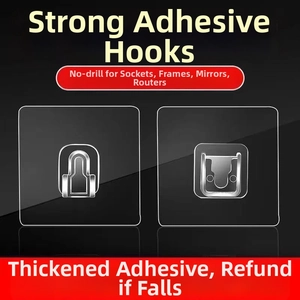 Macro detail of transparent interlocking adhesive wall hooks for frames and power strips