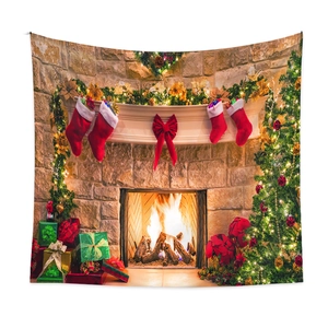 Close-up of bohemian Christmas tapestry featuring a cozy fireplace and festive tree scene