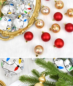 Detailed view of assorted Christmas ornaments with textured baubles on a gold tray
